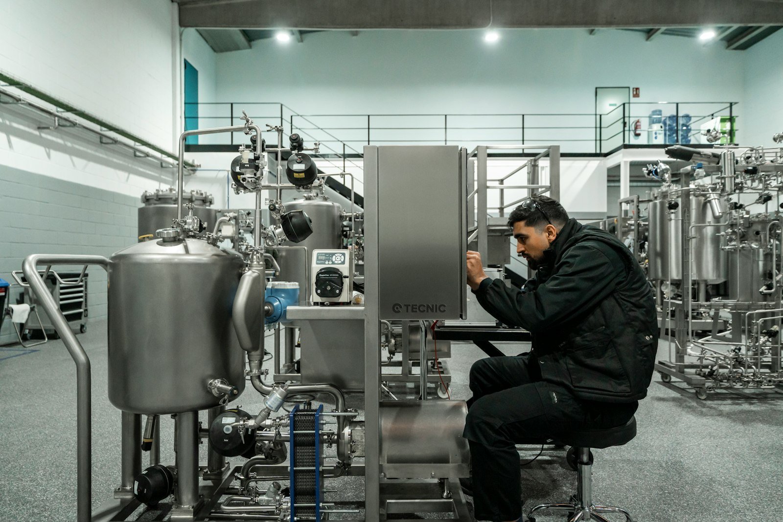 Engineer maintaining stainless steel ASME BPE process equipment