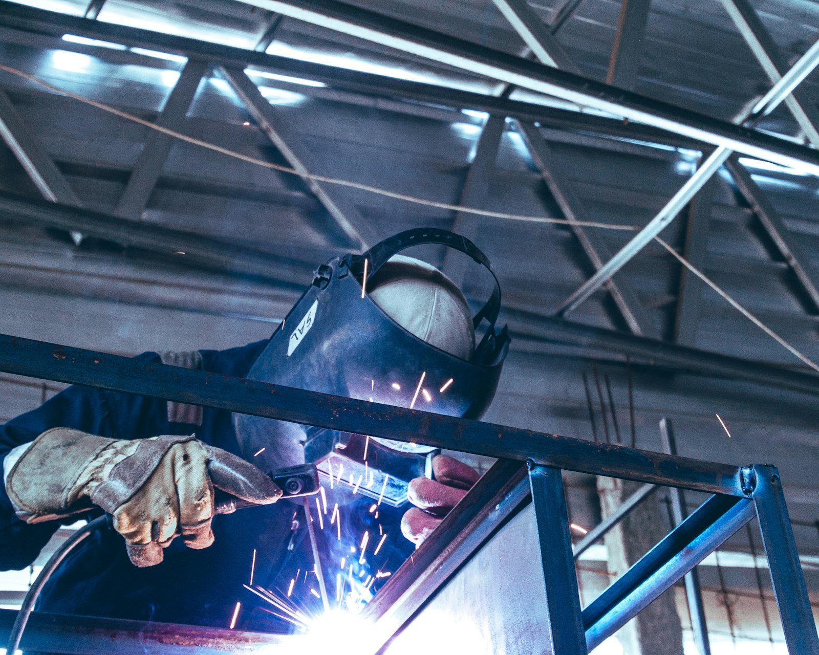 Welder joining stainless steel cross fittings